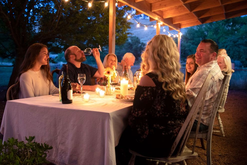 People eating at a table outside