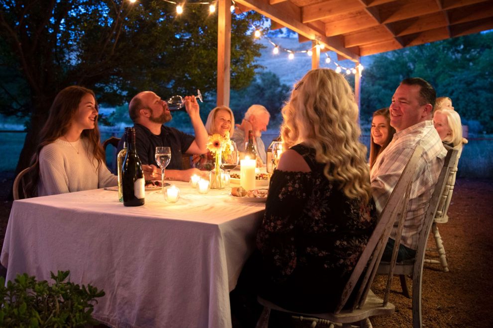 People eating at a table outside