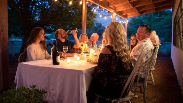People eating at a table outside