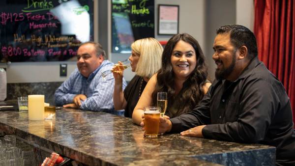 People drinking at a bar