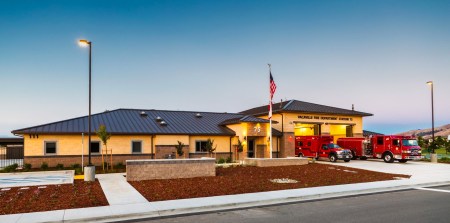 Vacaville fire department building with firetrucks in front.
